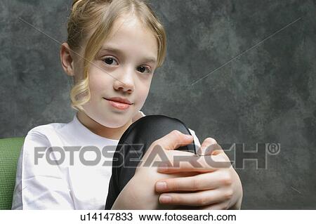 Portrait of a young girl View Large Photo Image Stock Image - Portrait of a young girl. Fotosearch