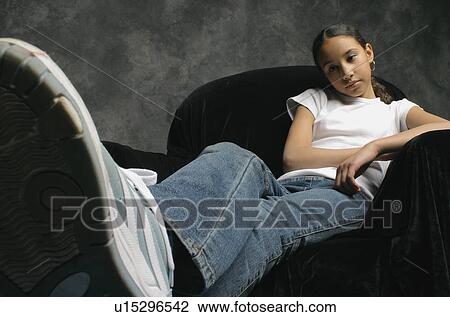 Portrait of a young girl View Large Photo Image Stock Image - Portrait of a young girl. Fotosearch