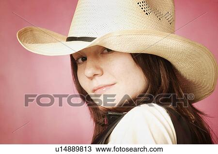 Stock Image - Portrait of cowgirl. Fotosearch