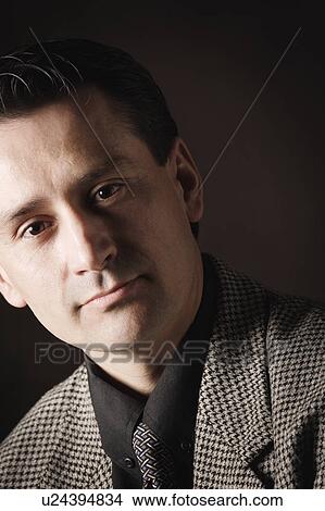 Picture - Portrait of dark-haired clean shaven man. Fotosearch