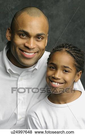 Stock Photo - Portrait of father and child. Fotosearch
