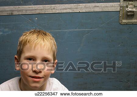 Stock Photo - Portrait of head and shoulders of young boy. Fotosearch