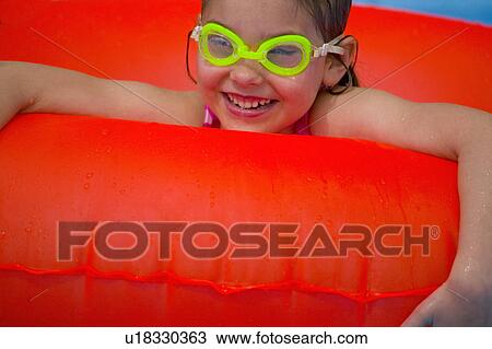 Portrait of little girl playing in Swimming Pool View Large Photo Image Stock Image - Portrait of little girl playing in Swimming Pool. Fotosearch