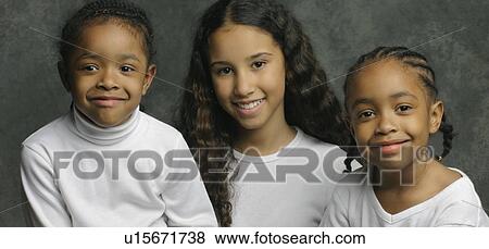 Stock Photo - Portrait of three young girls. Fotosearch