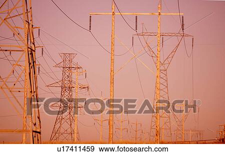 Power lines at dusk View Large Photo Image Stock Photo - Power lines at dusk. Fotosearch