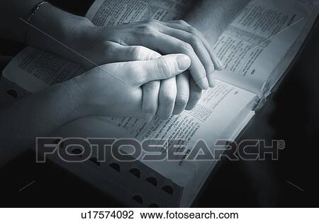 Stock Image - Praying the promises of the Word. Fotosearch