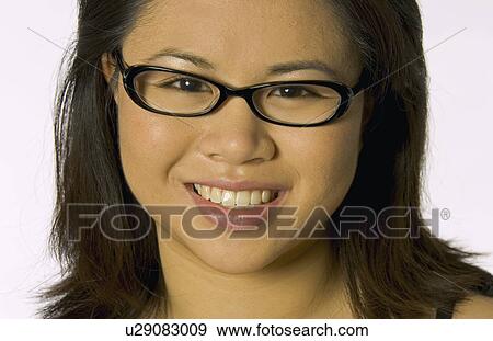 Stock Photo - Pretty girl wearing glasses. Fotosearch