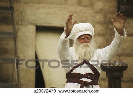 Priest with arms outstretched View Large Photo Image Stock Photo - Priest with arms outstretched. Fotosearch