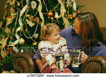 Reading a book on Christmas View Large Photo Image Stock Photo - Reading a book on Christmas. Fotosearch