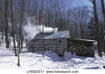 Stock Photo - Remote log cabin in winter. Fotosearch