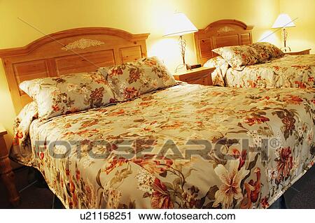 Stock Image - Resort bedroom interior. Fotosearch