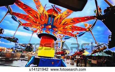 Ride at an amusement park View Large Photo Image Stock Image - Ride at an amusement park. Fotosearch