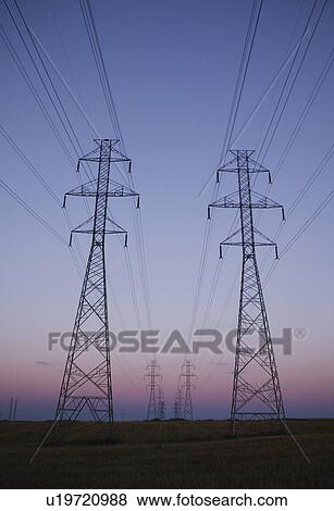 Rows of electricity pylons View Large Photo Image Stock Photo - Rows of electricity pylons. Fotosearch