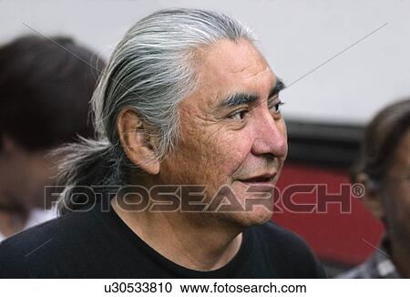 Stock Image - Senior man with long gray hair. Fotosearch