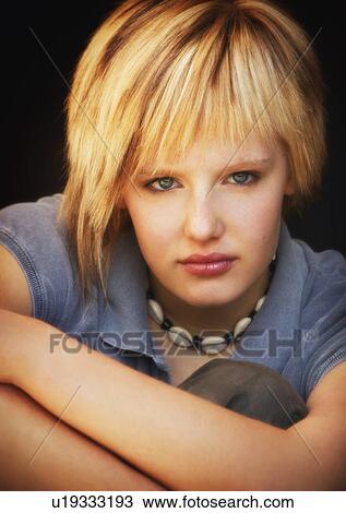 Stock Image - Serious portrait of a teen. Fotosearch