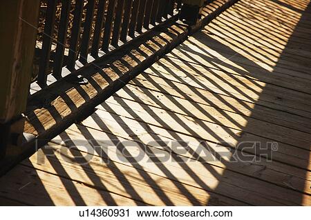 Shadow of wooden railing View Large Photo Image Stock Image - Shadow of wooden railing. Fotosearch