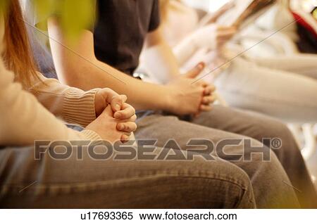 Sitting with clasped hands View Large Photo Image Stock Photography - Sitting with clasped hands. Fotosearch