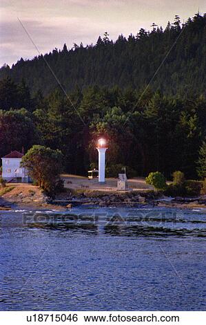 Stock Photograph - Small lighthouse on shore. Fotosearch