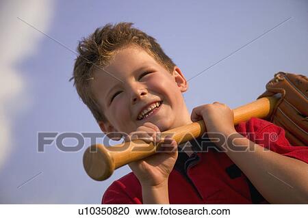 Smiling boy with a baseball bat View Large Photo Image Stock Image - Smiling boy with a baseball bat. Fotosearch