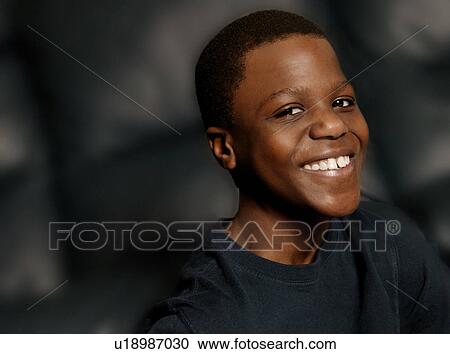 Stock Image - Smiling teenage boy. Fotosearch