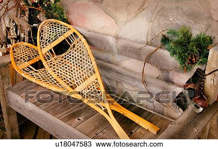 Snowshoes and old ice skates View Large Photo Image Stock Image - Snowshoes and old ice skates. Fotosearch