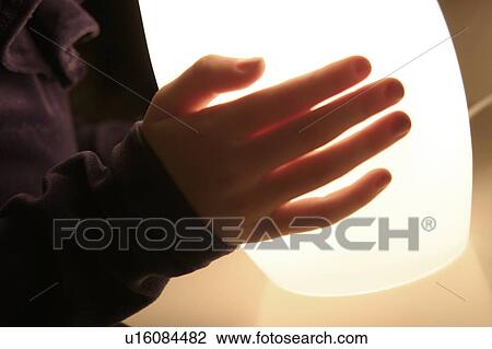 Someone carrying a lamp View Large Photo Image Stock Image - Someone carrying a lamp. Fotosearch