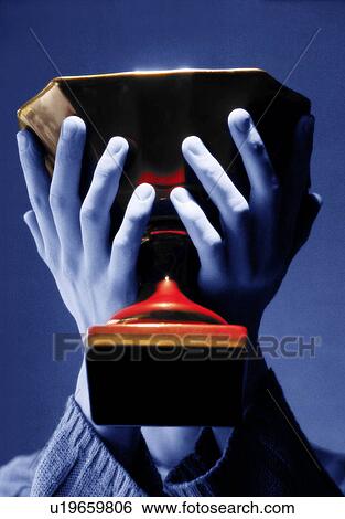 Stock Photograph - Someone holding a vessel. Fotosearch
