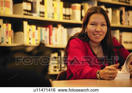 Student in the library View Large Photo Image Stock Photograph - Student in the library. Fotosearch
