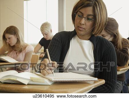 Stock Photography - Students doing an assignment. Fotosearch
