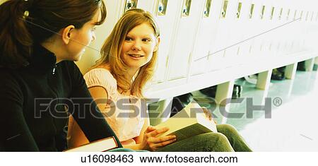 Students sitting in hallway View Large Photo Image Stock Image - Students sitting in hallway. Fotosearch