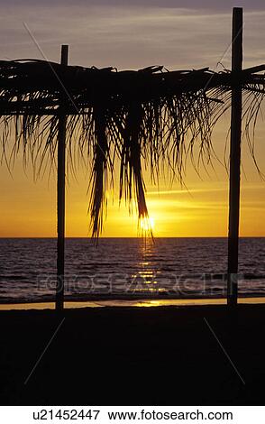 Sun setting on water View Large Photo Image Stock Photo - Sun setting on water. Fotosearch