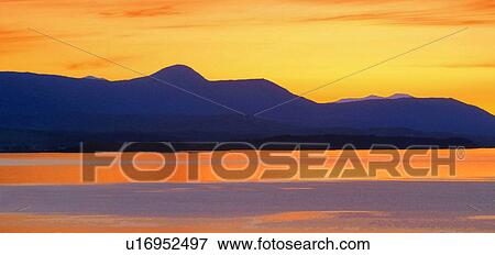 Sunset and mountain silhouette View Large Photo Image Stock Photo - Sunset and mountain silhouette. Fotosearch