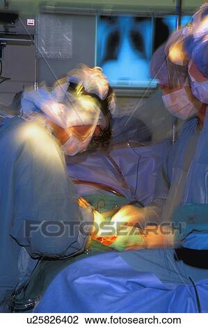 Surgeons Operating on Patient View Large Photo Image Stock Image - Surgeons Operating on Patient . Fotosearch