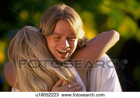 Teen couple hugging View Large Photo Image Stock Image - Teen couple hugging. Fotosearch