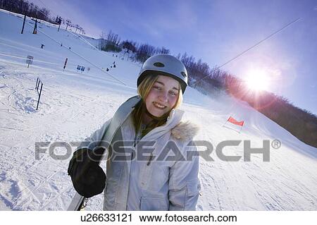 Stock Image - Teen on ski hill. Fotosearch