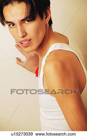 Teenager leaning on wall View Large Photo Image Stock Photo - Teenager leaning on wall. Fotosearch
