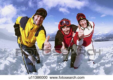 Three skies posing for picture View Large Photo Image Stock Image - Three skies posing for picture. Fotosearch