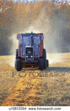 Picture - Tractor in a field. Fotosearch