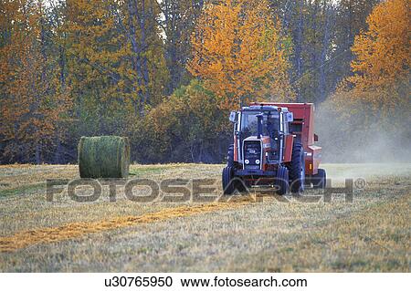 Stock Image - Tractor in field. Fotosearch
