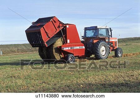 Tractor making bales View Large Photo Image Stock Image - Tractor making bales. Fotosearch