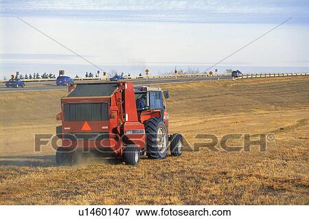 Tractor working beside highway View Large Photo Image Stock Photo - Tractor working beside highway. Fotosearch