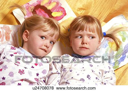 Stock Photo - Twin expressions. Fotosearch