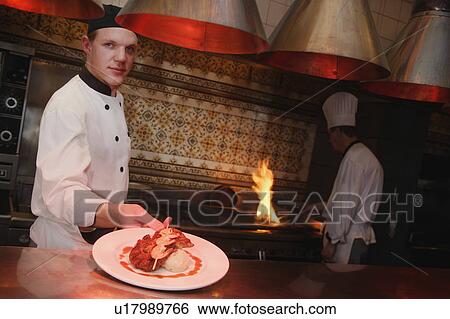 Stock Photograph - Two chefs at work. Fotosearch