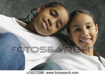 Stock Photograph - Two girls hanging out. Fotosearch