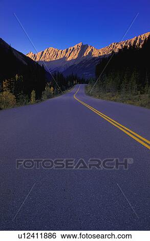 Two lane highway in narrow mountain valley View Large Photo Image Stock Photograph - Two lane highway in narrow mountain valley. Fotosearch