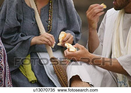 Two people eating View Large Photo Image Stock Photography - Two people eating. Fotosearch