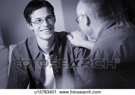 Two people having a conversation View Large Photo Image Stock Image - Two people having a conversation. Fotosearch