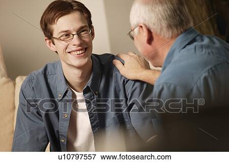 Two people having a conversation View Large Photo Image Stock Photo - Two people having a conversation. Fotosearch