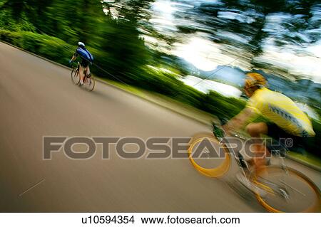 Picture - Two people on bikes. Fotosearch
