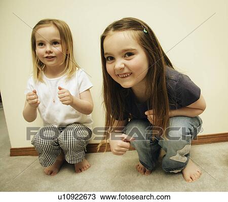 Two small girls playing View Large Photo Image Stock Image - Two small girls playing. Fotosearch